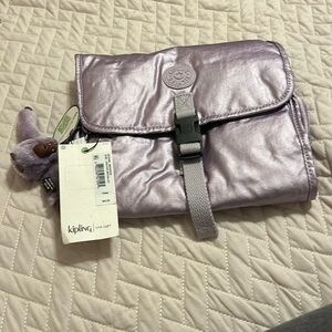 Kipling toiletry travel bag . Color orchid metallic.